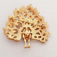 Broche pauw met strass